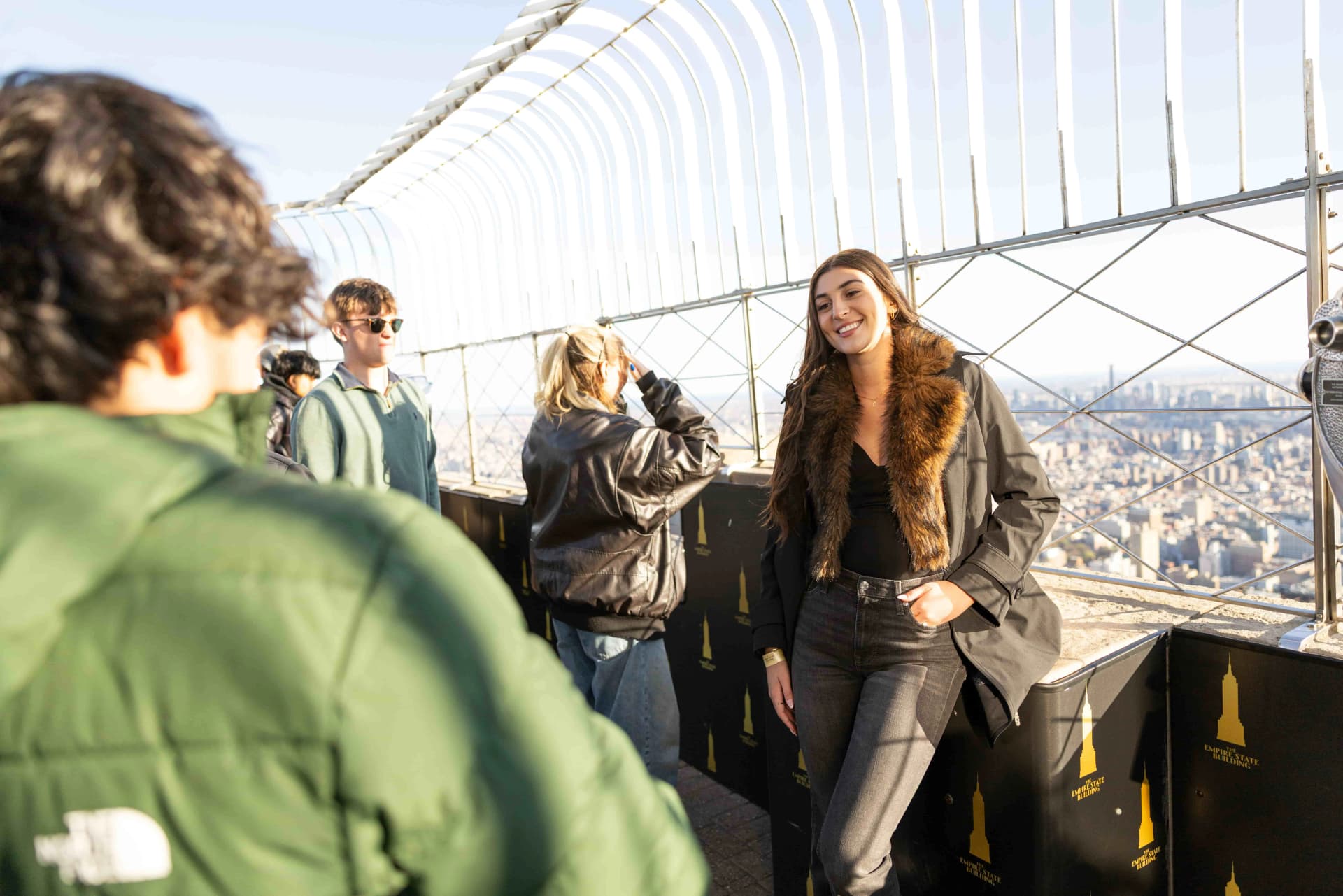 People looking out at the Empire State Building's 86th Floor Observation Deck