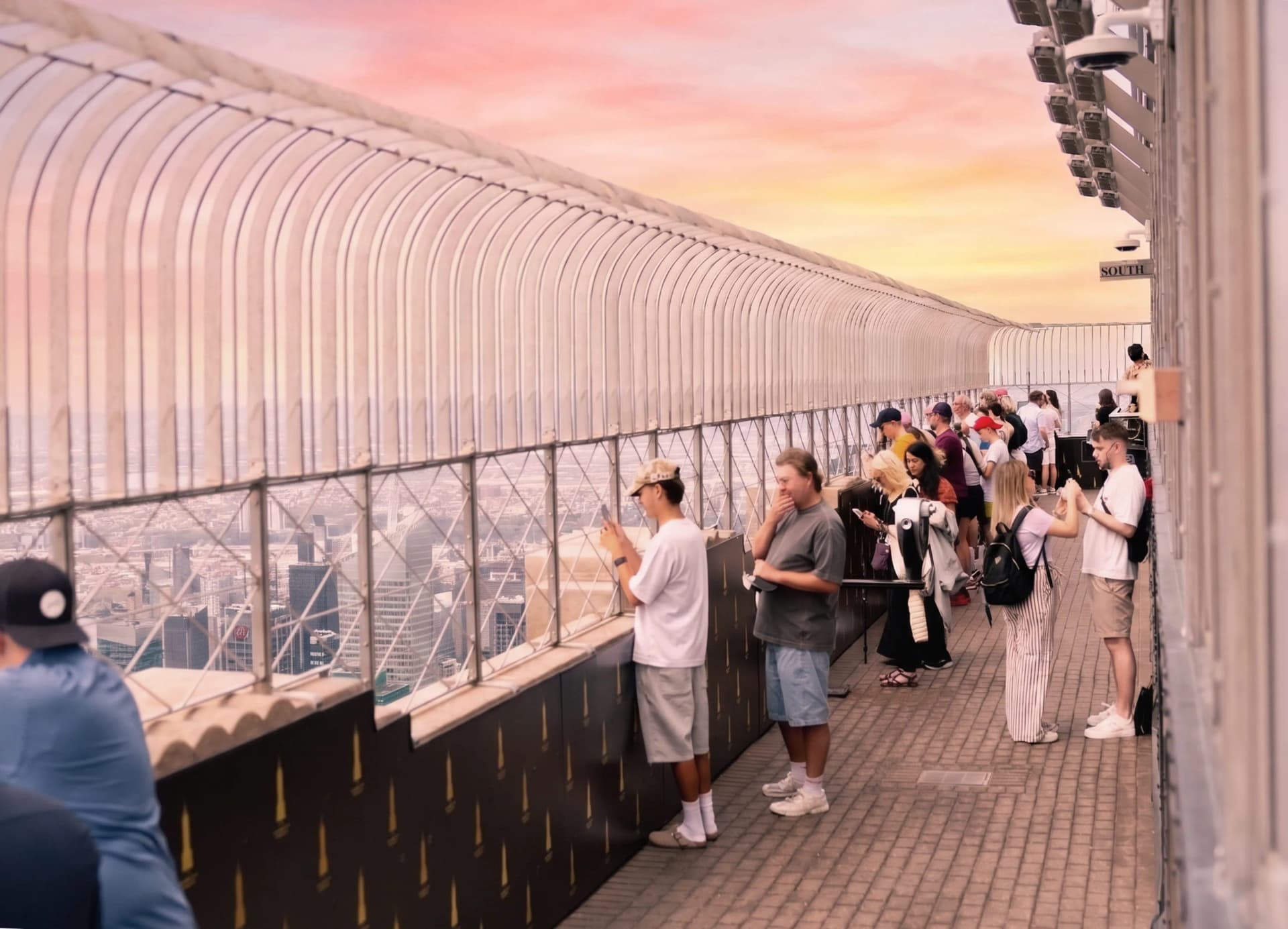People along an observation deck looking out to the best views of NYC