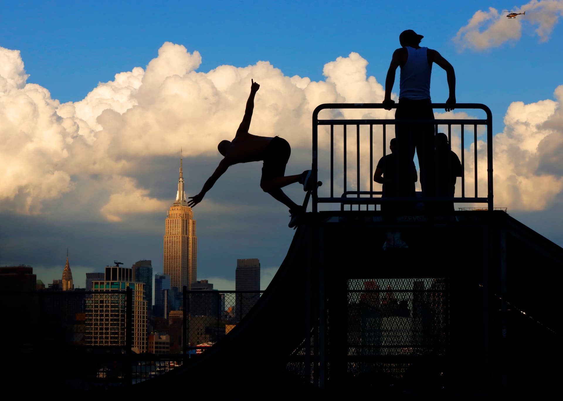 skateboarders with ESB in background