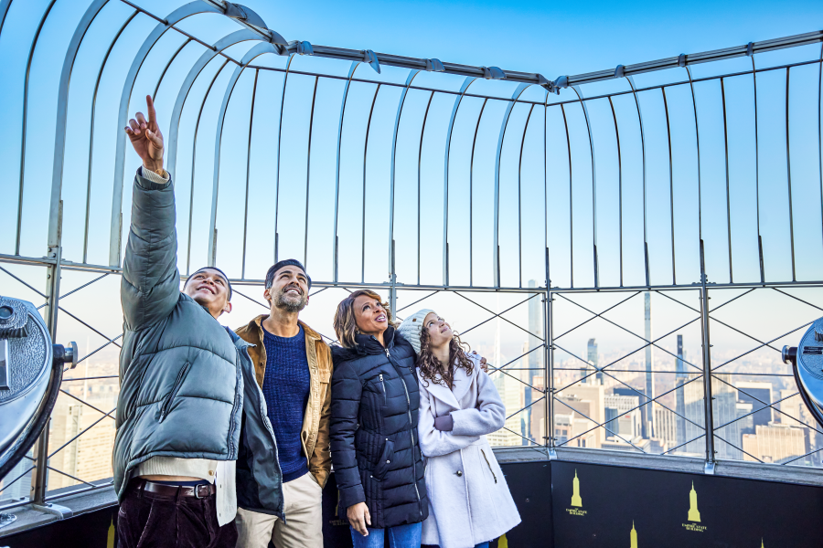 Family on the 86th Floor at the Empire State Building Observatory overlooking view.