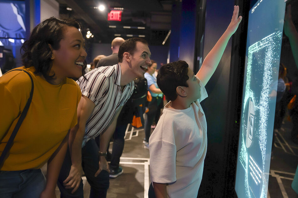 Family at sustainability exhibit at the Empire State Building Observatory