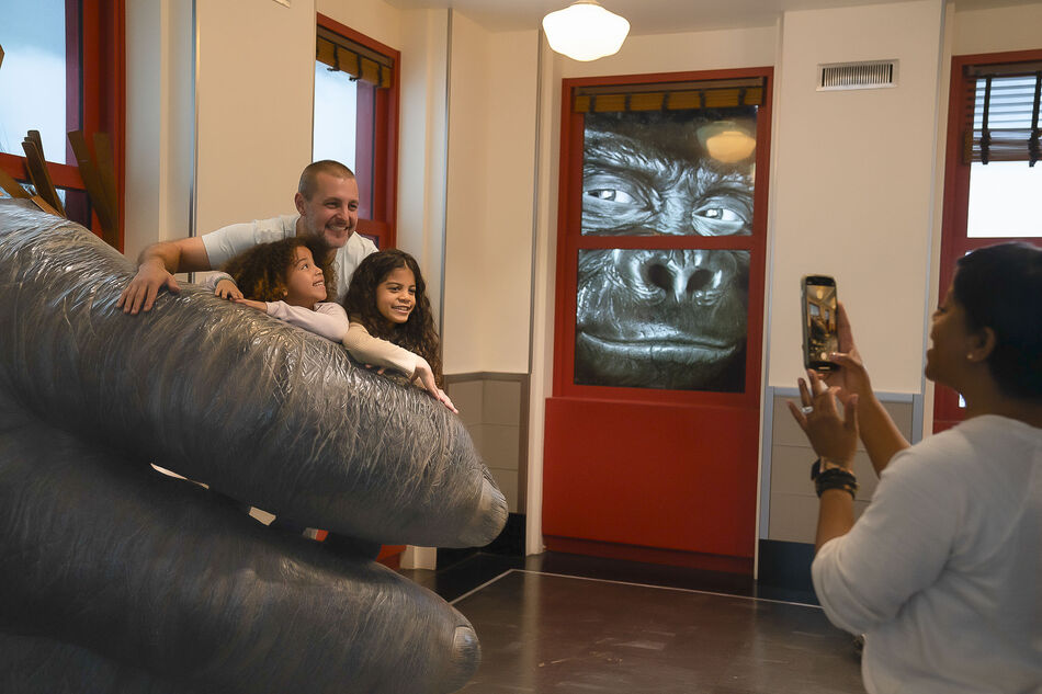 Family taking photo at the Empire State Building's Kong exhibit