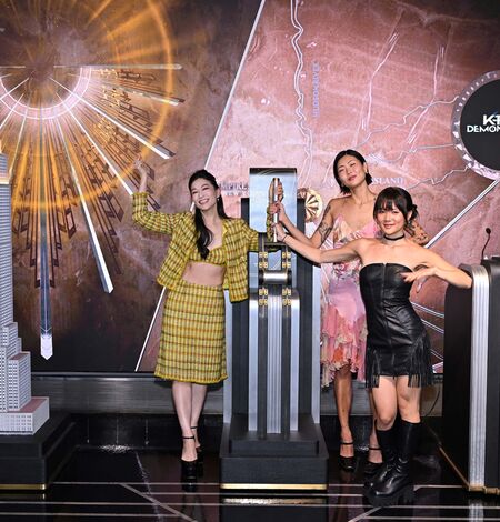 Arden Cho, May Hong, and REI AMI light the Empire State Building