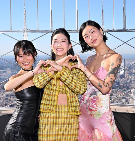 Arden Cho, May Hong, and REI AMI on the 86th Floor Observatory