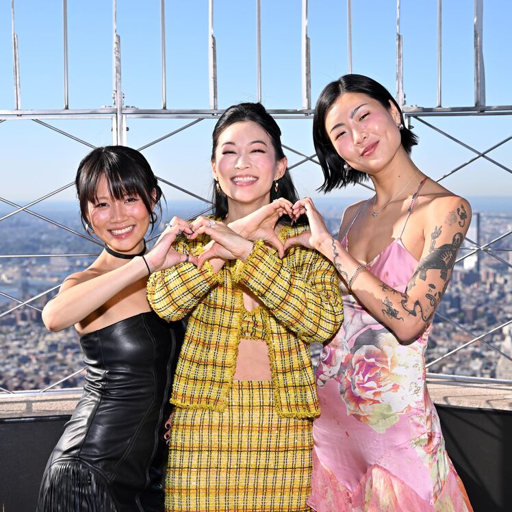 Arden Cho, May Hong, and REI AMI on the 86th Floor Observatory